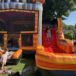 Large jumpy house that can also be used as a water slide.