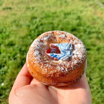 Little Fox Bakehouse - a hand holding a doughnut - Bakeries Near Me - Richmond, British Columbia Little Fox Bakehouse - a hand holding a doughnut - Bakeries Near Me - Richmond, British Columbia