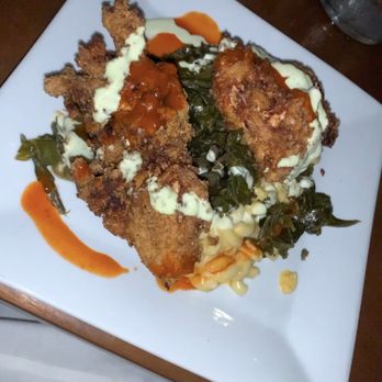 The Local - Buttermilk-brined fried chicken with pimento cheese mac and cheese, collard greens, house made hot sauce and a buttermilk-chive drizzle - New American Near Me - Charlottesville, Virginia The Local - Buttermilk-brined fried chicken with pimento cheese mac and cheese, collard greens, house made hot sauce and a buttermilk-chive drizzle - New American Near Me - Charlottesville, Virginia