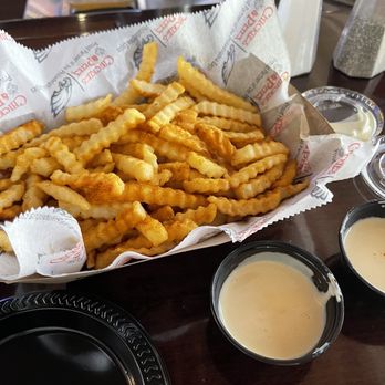 Chickie's & Pete's - Seasoned crab fries with cheese sauce World Famous Crabfries - New American Near Me - Philadelphia, Pennsylvania