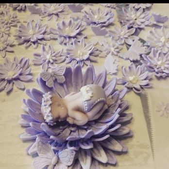 Camila's Cakes - a baby sleeping on a flower - Desserts Near Me