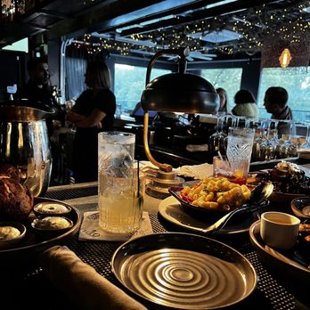 Arnette's Chop Shop - a table of food and drinks - Steakhouses Near Me - Brookhaven, Georgia