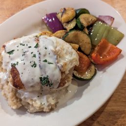 Crab-stuffed Flounder ($26) is served with grilled veggies and a creamy risotto. Crab-stuffed Flounder ($26) is served with grilled veggies and a creamy risotto.