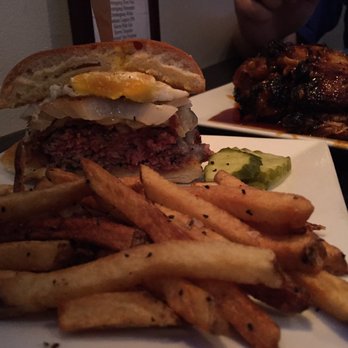 The Brass Monkey - The Adirondack Burger, with some Purple Cow wings in the background - Burgers Near Me - Gloversville, New York The Brass Monkey - The Adirondack Burger, with some Purple Cow wings in the background - Burgers Near Me - Gloversville, New York
