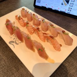 Nigiri (Albacore, Seared Salmon & Yuzu Yellowtail) Nigiri (Albacore, Seared Salmon & Yuzu Yellowtail)