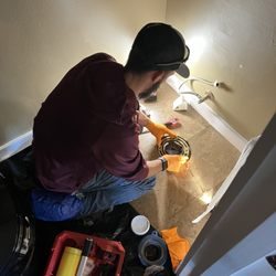 Reliant Plumbing - Reliant Plumber installing a new wax ring for a toilet.