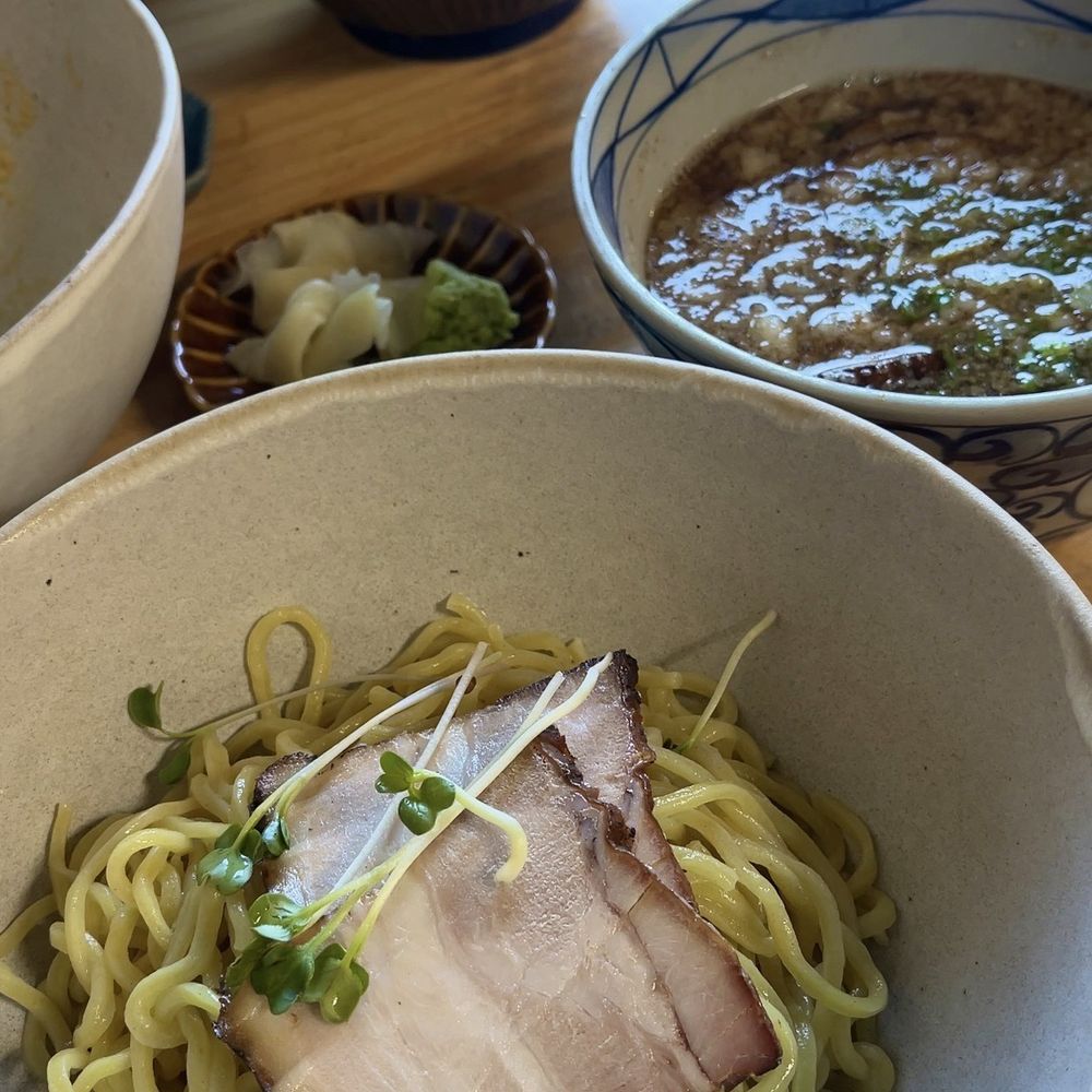 Tsukemen chicken broth with soy sauce base dipping soup. Cold noodle topping with 2 pieces of Char Siu, Bamboo shoots and Green Onions