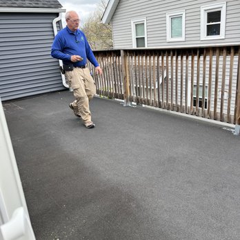 MSRE Home Inspection Services - Bill inspecting the walk out balcony - Home Inspectors Near Me - Cleveland, Ohio