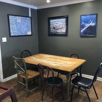 Carlisle's Pizza Tavern - a table and chairs - Pizza Near Me - Roswell, Georgia Carlisle's Pizza Tavern - a table and chairs - Pizza Near Me - Roswell, Georgia