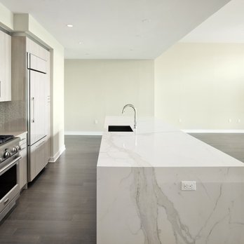 Porcelain Source - a kitchen with a marble island - Kitchen & Bath Near Me - Roseland, New Jersey