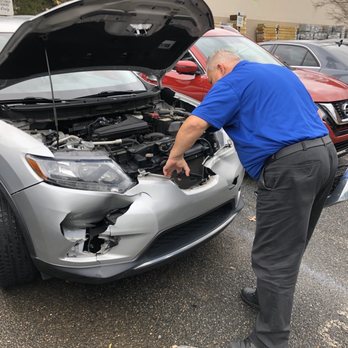 Caliber Collision - Mike Dressel inspecting our car! - Body Shops Near Me - Cumming, Georgia
