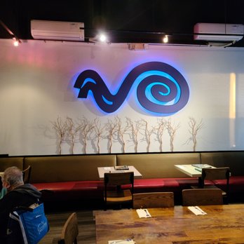 Noodle Wave - people sitting at tables in a restaurant - Thai Near Me - Garland, Texas