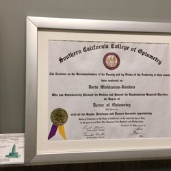 Doctor graduated summa cum laude and salutatorian.