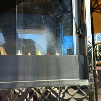 Ariana Hot Dog Stand - a reflection of a man in the window - Hot Dogs Near Me - Emeryville, California Ariana Hot Dog Stand - a reflection of a man in the window - Hot Dogs Near Me - Emeryville, California