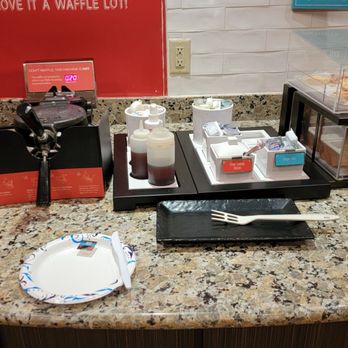 Hampton Inn & Suites Winnie - Waffle and baked goods area - Hotels Near Me - Winnie, Texas