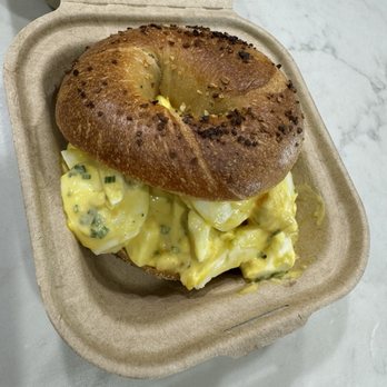 The Williamson County Bagel Company - Farmer's Egg Salad: plain bagel, mayo, chive, salt, pepper, olive oil, soft boiled egg $10.00 I subbed an onion bagel instead of plain. - Bagels Near Me - Cedar Park, Texas The Williamson County Bagel Company - Farmer's Egg Salad: plain bagel, mayo, chive, salt, pepper, olive oil, soft boiled egg $10.00 I subbed an onion bagel instead of plain. - Bagels Near Me - Cedar Park, Texas