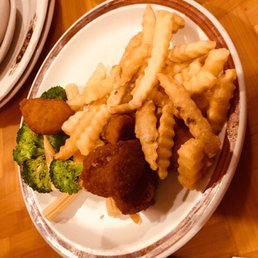 a plate of fish and chips and broccoli