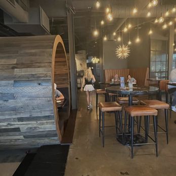 Hangar Kitchen Plus Bar - Interior with barrel booths and some bar area - Tacos Near Me - St. Louis, Missouri