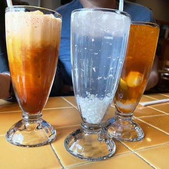 Neecha Thai - From left, Thai Ices tea, coconut juice, and lychee iced tea. - Thai Near Me - Oakland, California