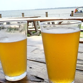 Lake Houston Brewery - two glasses of beer on a picnic table - Breweries Near Me - Huffman, Texas Lake Houston Brewery - two glasses of beer on a picnic table - Breweries Near Me - Huffman, Texas