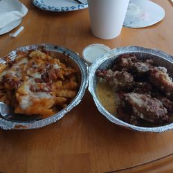 The Blocton Sports Grill - Left is Cajun Cheese Fries, on the right, perfectly cooked and seasoned bone in wings...both delicious