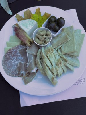 Photo of Stevens Winery - Woodinville, WA, US. sitting under the blue tent and enjoying vino, conversation, and this tasty plate of munchies.