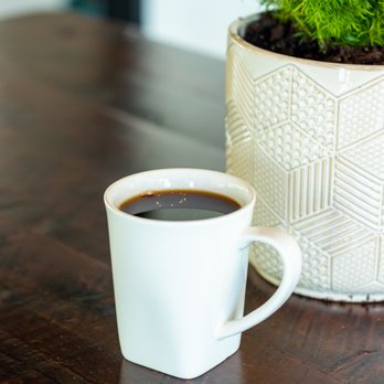 Grassroots Kava House - a cup of coffee on a table - Coffee & Tea Near Me - Tampa, Florida Grassroots Kava House - a cup of coffee on a table - Coffee & Tea Near Me - Tampa, Florida