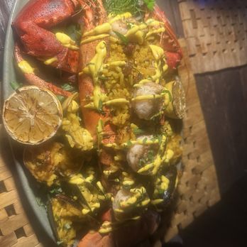 Sol by the Sea - Lobster stuffed saffron rice with shrimp and mussels - Caribbean Near Me - Key Largo, Florida Sol by the Sea - Lobster stuffed saffron rice with shrimp and mussels - Caribbean Near Me - Key Largo, Florida