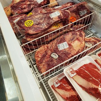 H-E-B - My favorite section - A selection of beef cuts, including steaks and roasts, are arranged in a freezer at a grocery store, with price tags visible. - Grocery Near Me - Magnolia, Texas