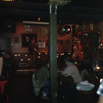 Owl'n Thistle Irish Pub - Back room with stage and live irish band - Irish Near Me - Seattle, Washington