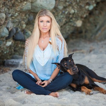 Pet Photogrtaphy A Long Hair Blonde Woman Sitting In The Sand At