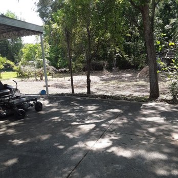YardMasters Lawn Care Services - a man riding a lawn mower - Gardeners Near Me - Elba, Alabama