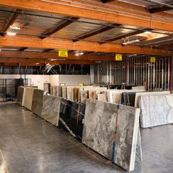 Legacy Stone & Marble - New Showroom featuring a wide range selection of marble, quartzite, granite, quartz, and porcelain slabs.