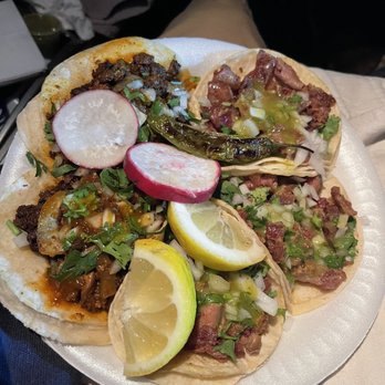 Tacos Valles - a plate of tacos with lemon wedges - Mexican Near Me - Castaic, California