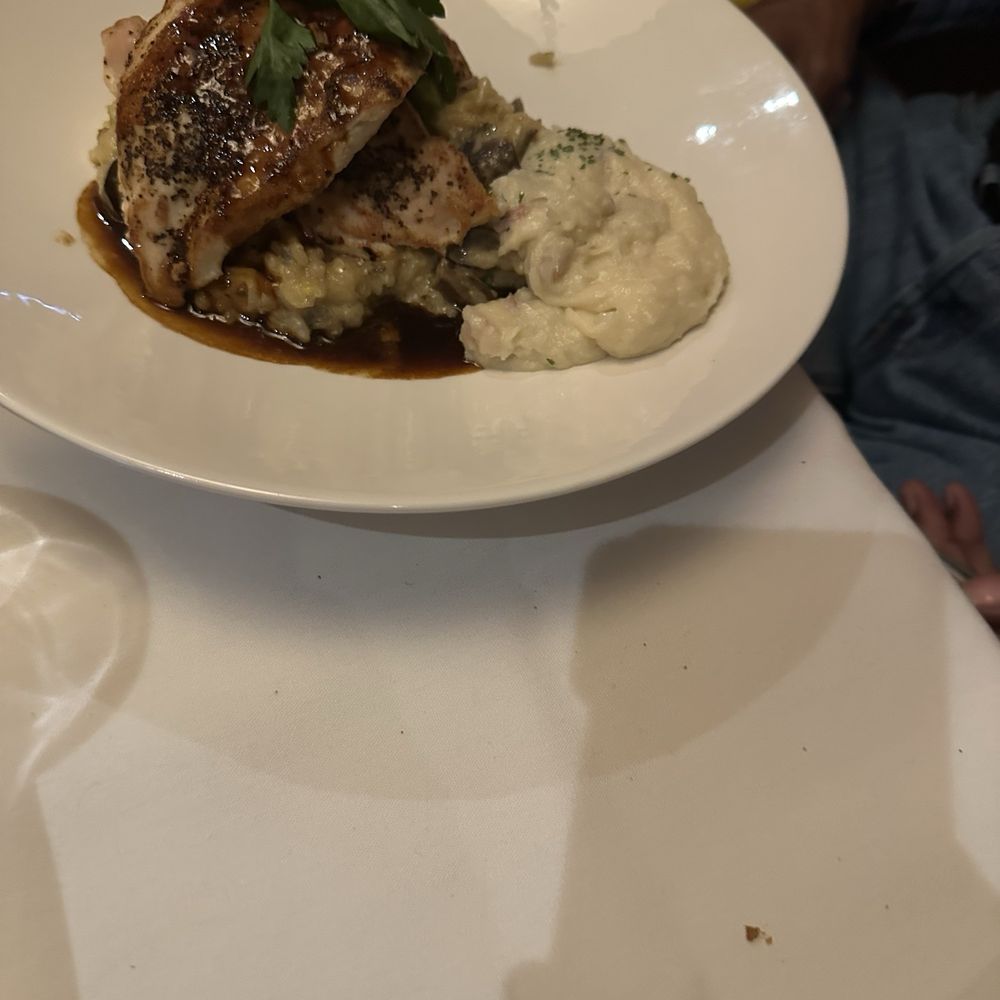 The Capital Grille - Roasted Chicken Breast with Mushrooms and Parmesan Risotto - Steakhouses Near Me - Burbank, California The Capital Grille - Roasted Chicken Breast with Mushrooms and Parmesan Risotto - Steakhouses Near Me - Burbank, California