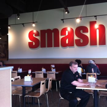 Smashburger - people sitting at tables in a restaurant - Burgers Near Me - Calgary, Alberta
