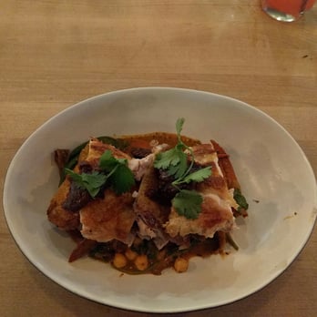 True Food Kitchen - Moroccan Half-Chicken with mission fig, heirloom carrot, chickpea, olive, spinach, and chermoula. Spoon delicious and healthful! - New American Near Me - Denver, Colorado
