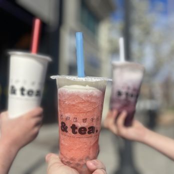 & Tea - two people holding up two cups of iced tea - Bubble Tea Near Me - Yakima, Washington & Tea - two people holding up two cups of iced tea - Bubble Tea Near Me - Yakima, Washington