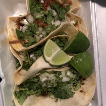 Lupita's Authentic Mexican Food - Barabcoa up top and sadly the lamb ones are at the end covered. Beefs in the middle. Yes it's a bad pic because of the car - Mexican Near Me - State College, Pennsylvania