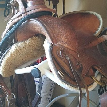 Red River Arenas - Association saddle.  Rolls off the saddle rack because its balanced on outside edge - not center - Rodeo Near Me - Coleman, Texas
