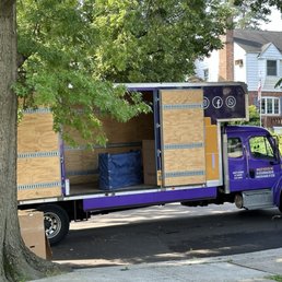 Smiley movers truck with doors open Smiley movers truck with doors open
