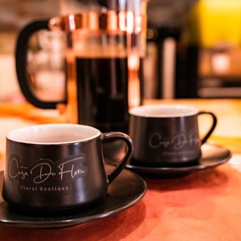 Casa De Flora Bar - two cups of coffee on a table - Coffee & Tea Near Me - Bloomfield, New Jersey Casa De Flora Bar - two cups of coffee on a table - Coffee & Tea Near Me - Bloomfield, New Jersey