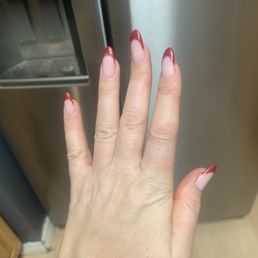 Beautiful red glitter French tip extensions . Sorry my middle finger is crooked- it's my finger, not the extensions!