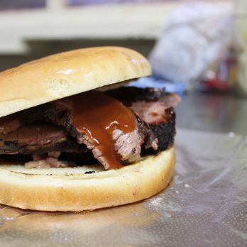 Pioneer BBQ - a pulled pork sandwich on a bun - Barbeque Near Me - Nixon, Texas