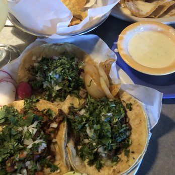 Taco Riendo - Beef, pastor, and beef cheek tacos. My friend had the special chicken nachos (he loved them)! - Mexican Near Me - Seneca, South Carolina