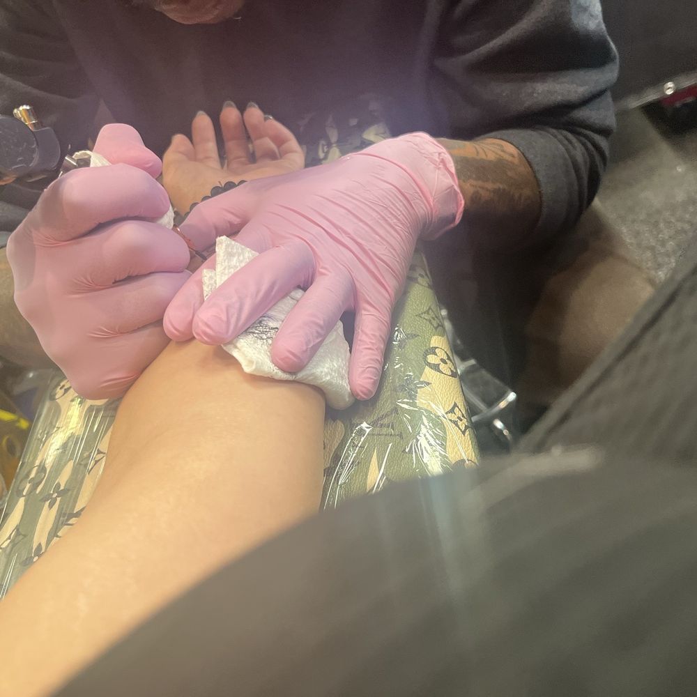 Iron Age Studios - Tattoo artist putting the tattoo on me - Tattoo Near Me - Saint Louis, Missouri Iron Age Studios - Tattoo artist putting the tattoo on me - Tattoo Near Me - Saint Louis, Missouri
