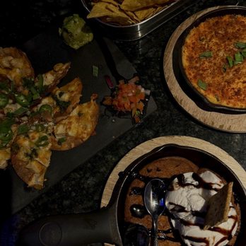Topgolf - S'mores Cookie Skillet with Vanilla ice cream and chocolate syrup, Buffalo chicken dip & chicken nacho average nachos. - Golf Near Me - Cranston, Rhode Island Topgolf - S'mores Cookie Skillet with Vanilla ice cream and chocolate syrup, Buffalo chicken dip & chicken nacho average nachos. - Golf Near Me - Cranston, Rhode Island