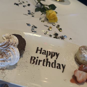 The Capital Grille - surprise birthday dessert (left is Flourless Chocolate Espresso Cake) (right is crème brûlée cheesecake) - Steakhouses Near Me - Costa Mesa, California The Capital Grille - surprise birthday dessert (left is Flourless Chocolate Espresso Cake) (right is crème brûlée cheesecake) - Steakhouses Near Me - Costa Mesa, California