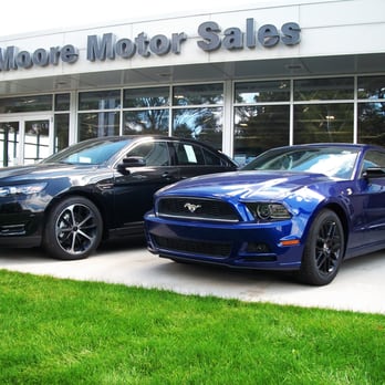 Moore Motor Sales - Store front with Ford vehicles. - Car Dealers Near Me - Caro, Michigan Moore Motor Sales - Store front with Ford vehicles. - Car Dealers Near Me - Caro, Michigan