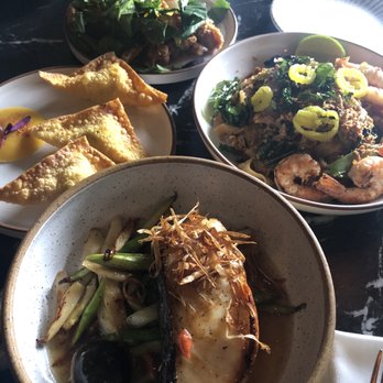 Akar - Drunken noodles (right) Crab Rangoon (left) Fried chicken (top) Sea bass (bottom) - Asian Fusion Near Me - St. Louis, Missouri